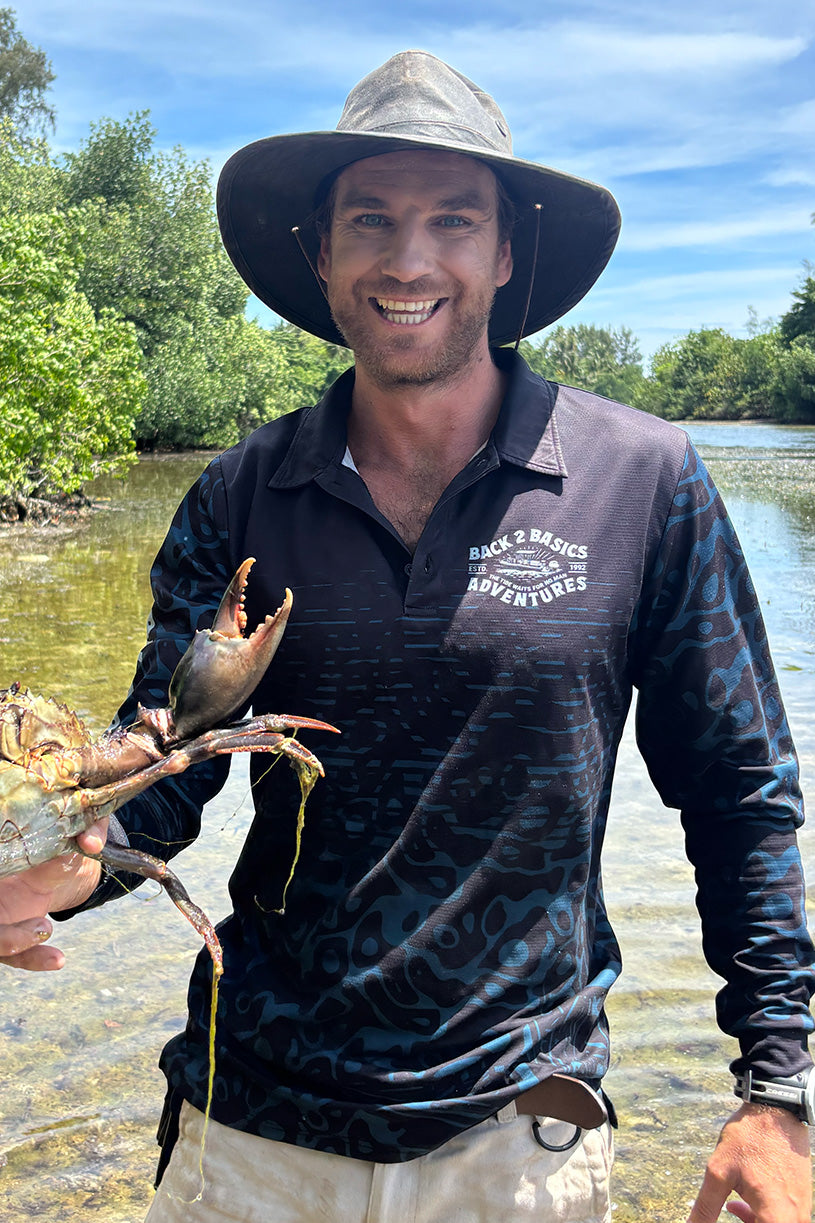 jack in his back 2 basics adventures fishing jersey holding a mud crab